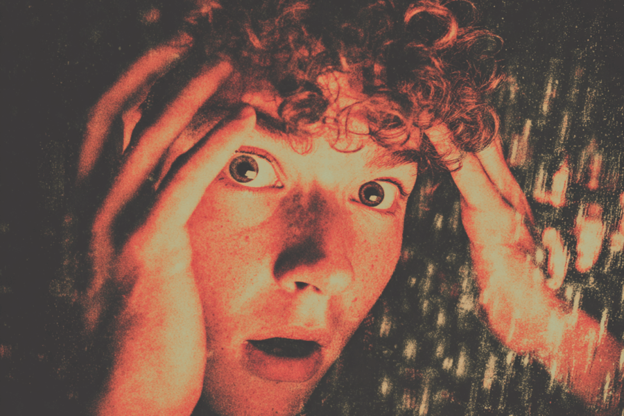 a man's closed up face full of fear